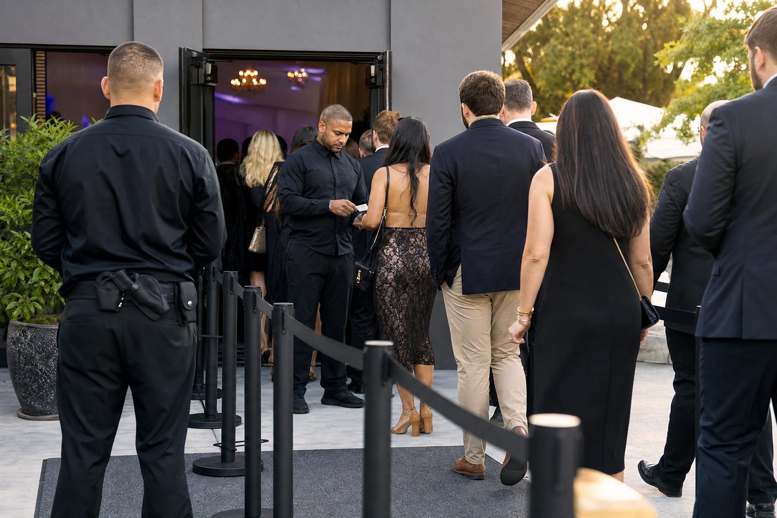 Swift Security officers checking credentials at a controlled event entrance